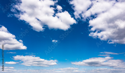 Beautiful blue sky with white clouds, aerial photography of the sky. Sunny day. 