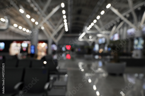 Blurred view of waiting area with seats in airport terminal