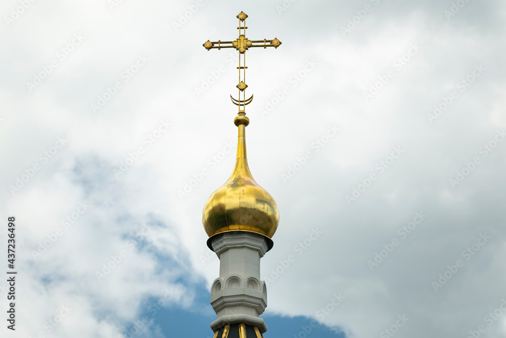 Golden cross on sky. Cross on the church roof Golden cross on sky. Cross on the church roof