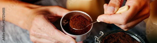 man prepares coffee in a moka pot, web banner photo