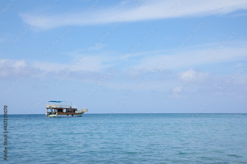 Beautiful view of tranquil sea and boat on sunny summer day