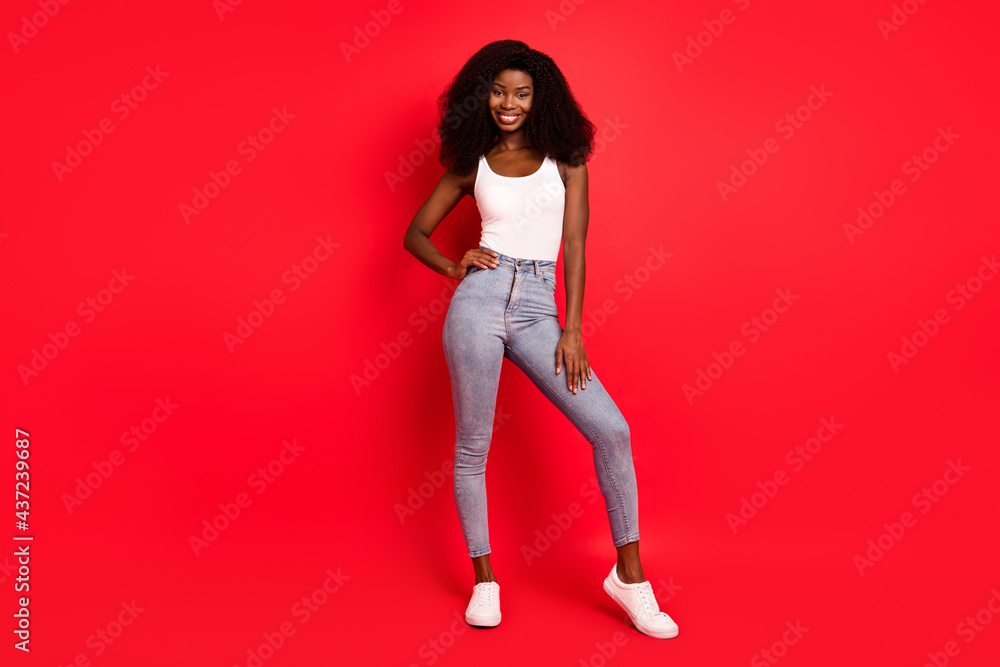 Full body photo of young attractive black girl happy positive smile wear casual outfit isolated over red color background