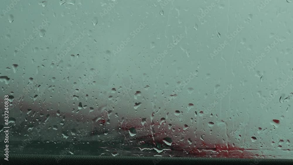 Flowing down water drops on glass. raindrops on the window, flow down. fall Flowing down water drops on glass. raindrops on the window, flow down. fall