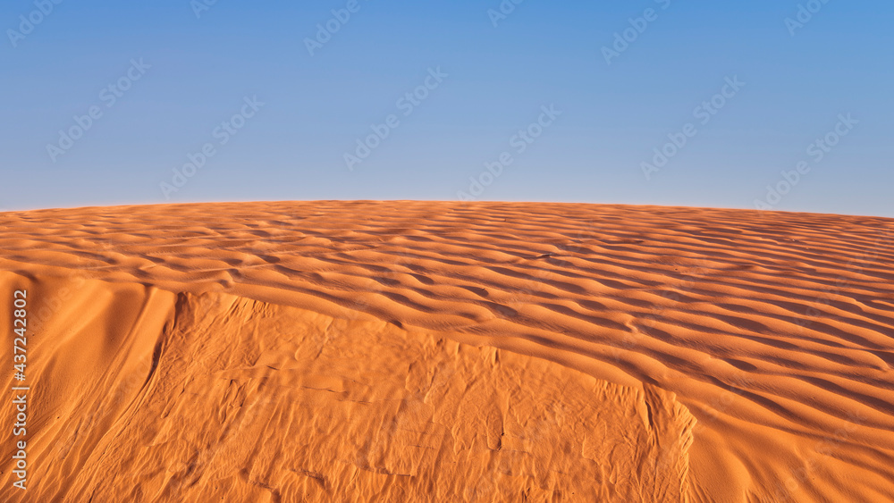 Naklejka premium wind blowing sand over a sand dune in San Rafael Swell area in Utah