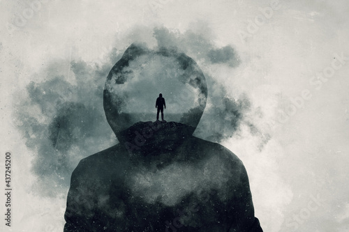 A mental health concept. A mans head covered in clouds. With a double exposure of a mans silhouette over layered on top. photo