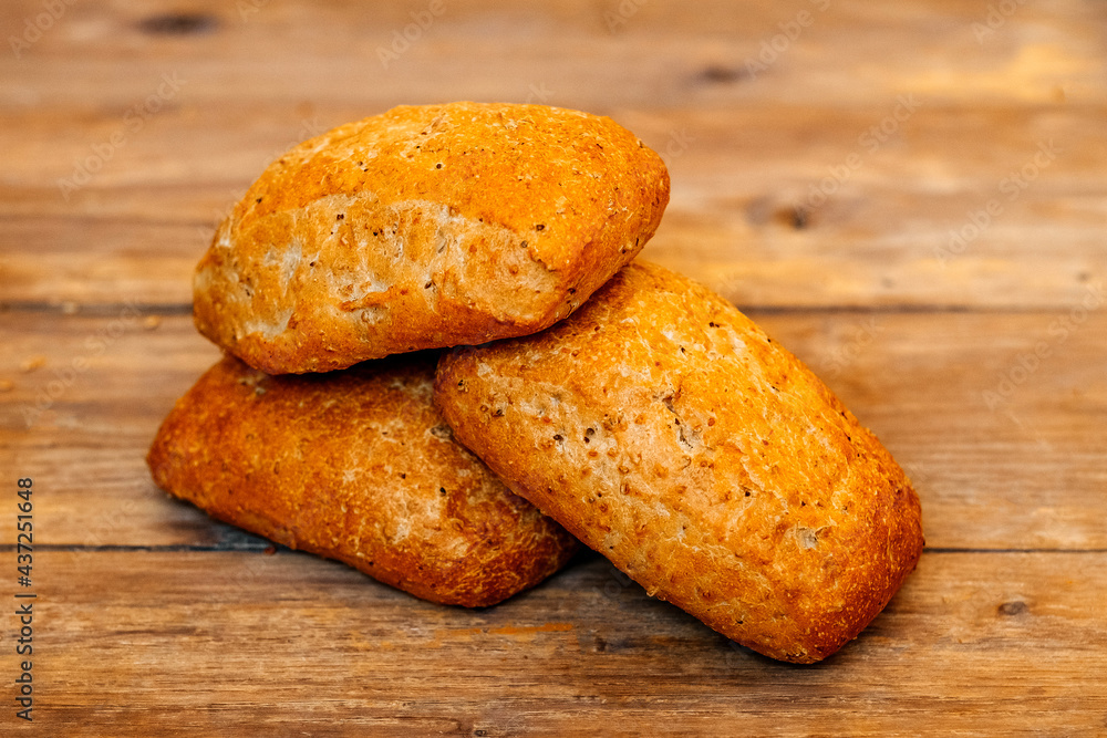 Buns for burgers and sandwiches, sesame bun, buns. Fresh burger bread with sesame seeds on a wooden background. Delicious hamburger buns. Buns for burgers and sandwiches, sesame bun, buns. Fresh burger bread with sesame seeds on a wooden background. Delicious hamburger buns.