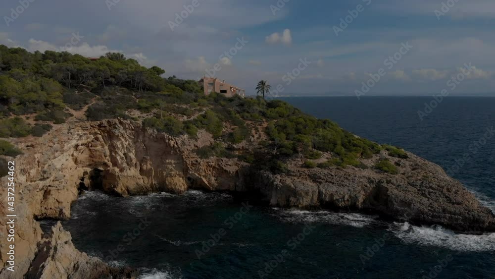 Drone point of view Mallorca nature, scenic landscape during sunny summer day. Breaking waves of Mediterranean Sea. Aerial view Playa Cap Falco in Spain, Europe, Baleares Drone point of view Mallorca nature, scenic landscape during sunny summer day. Breaking waves of Mediterranean Sea. Aerial view Playa Cap Falco in Spain, Europe, Baleares