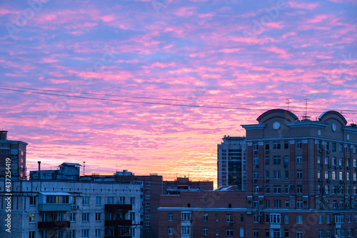 pink and blue sky over apartment houses