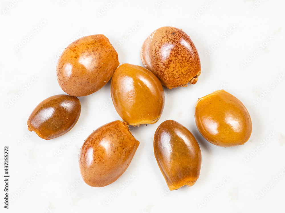 dried star anise (badian) seeds close up on gray dried star anise (badian) seeds close up on gray