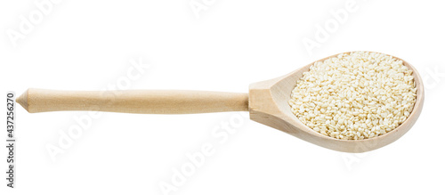 wooden spoon with white sesame seeds isolated