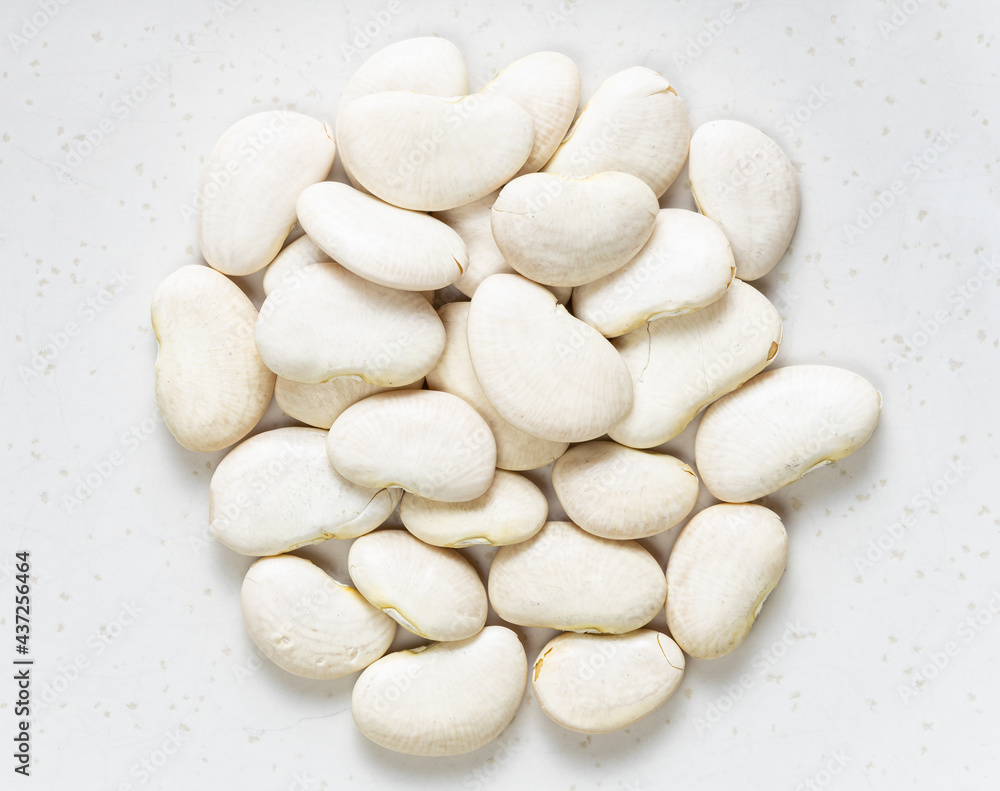 Obraz premium pile of raw lima beans close up on gray