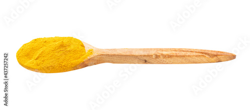 wood spoon with curcuma (turmeric) powder isolated