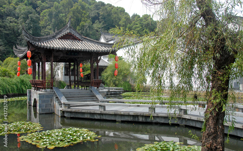 Jiangwan in Wuyuan County  Jiangxi Province  China. Jiangwan is an ancient town in Wuyuan County known for its Tang Dynasty architecture. Pavilion with red lanterns in a lotus pond.
