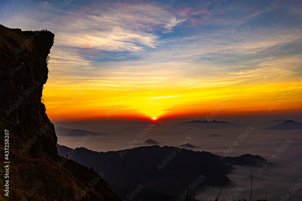 Beautiful landscape nature on peak mountain with sunrise in winter at viewpoint Phu Chi Fa