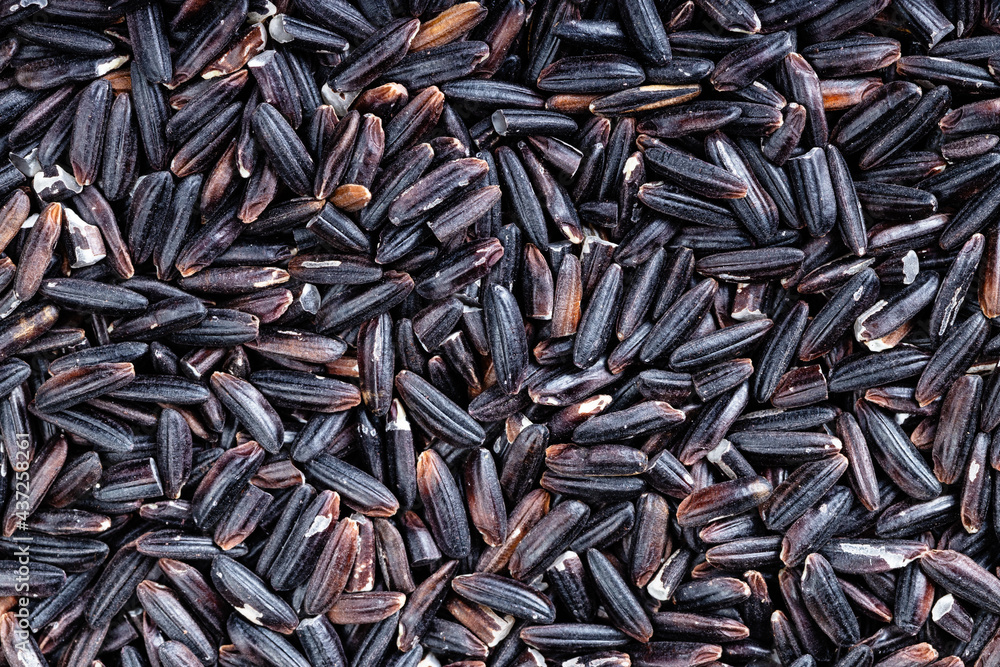 background - many raw black rice grains