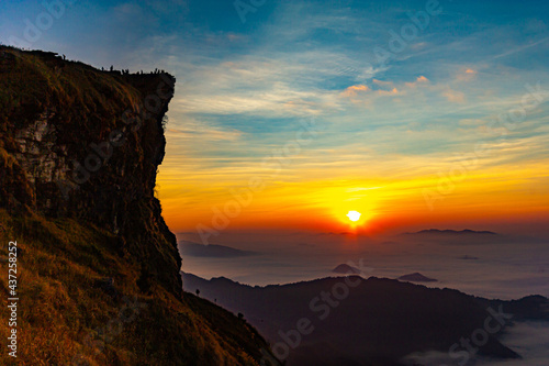Beautiful landscape nature on peak mountain with sunrise in winter at viewpoint Phu Chi Fa