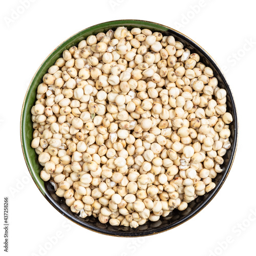 raw unpolished Sorghum grains in round bowl photo