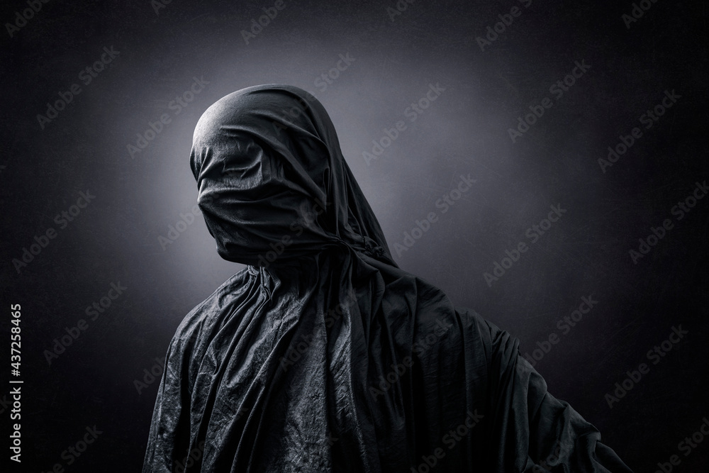 Creepy figure over dark misty background Creepy figure over dark misty background