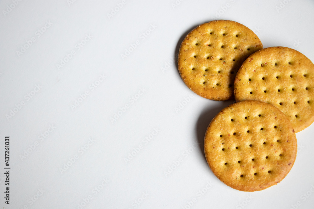 A close up of appetizer crackers on a white background.