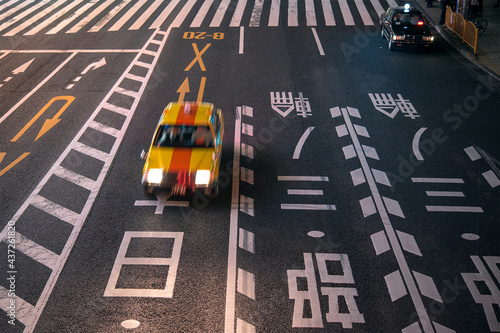 Motion blurred Yellow taxi cab in Tokyo at night　夜の東京を走るタクシー