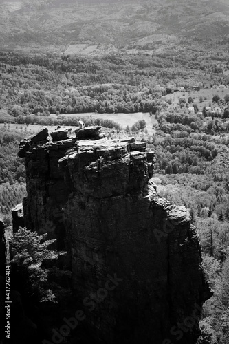 the wall. Man on the top of a hill 