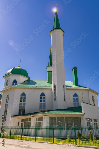 Dome towers are the minaret of a Muslim mosque for performing prayers and rituals of Muslims. Green roofs and white walls, at the top of the crescent moon as a symbol of Islam