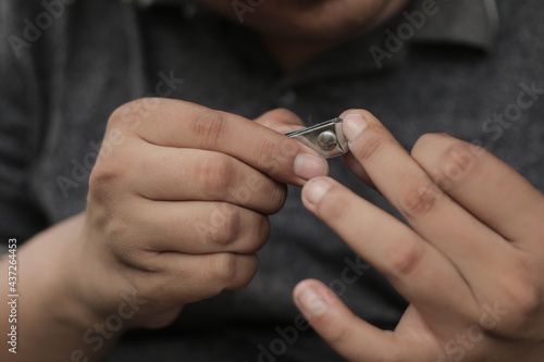 A man cuts his nails