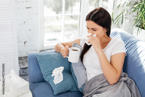 Weak female taking care about herself during illness