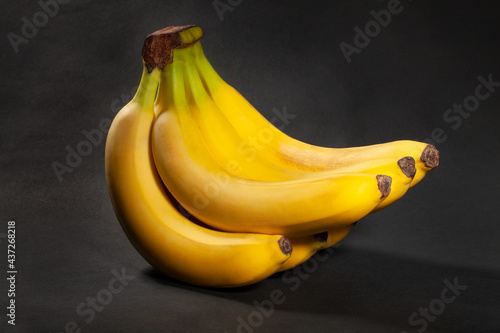 banana bunch on black background