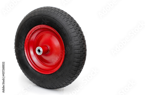 Red wheel and black tire on white. © Kevin Brine