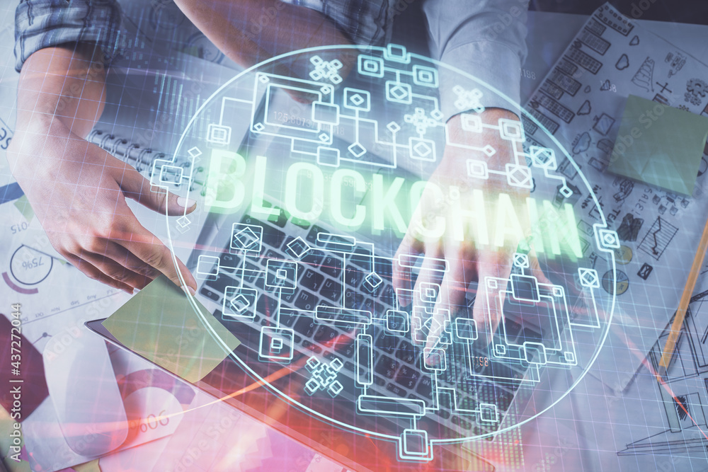 Double exposure of man and woman working together and crypto theme hologram drawing. Computer background. Blockchain concept. Top View. Double exposure of man and woman working together and crypto theme hologram drawing. Computer background. Blockchain concept. Top View.