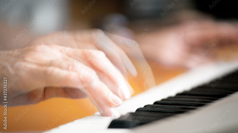 Obraz premium Male fingers playing the electric piano, multi-exposure