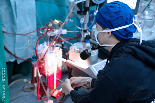 male perfusionist sitting in cardiac operating room photo