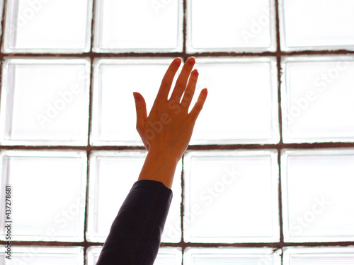 Girl's hand in the window