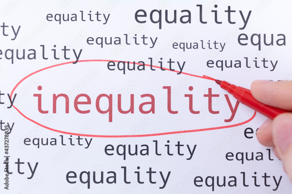 A hand with a pink marker is circling the word INEQUALITY.