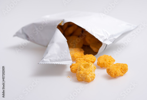 Corn puff snacks open bag packaging isolated on white background