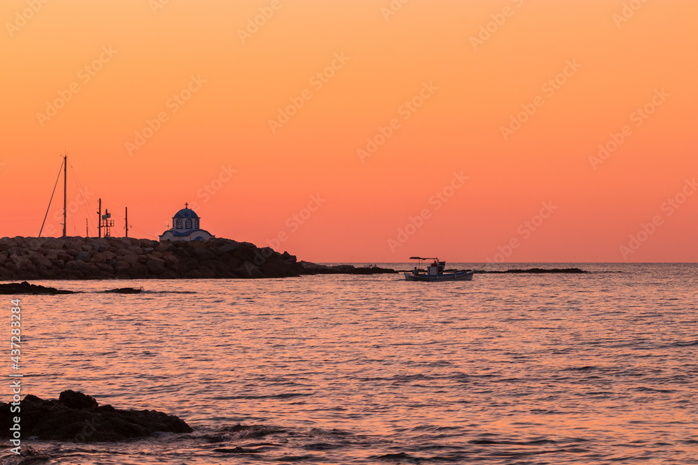 Gialiskari chapel and lonely fisherboat at dawn on the Noth Aegean Island of Ikaria island