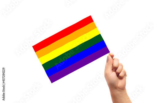 Mixed-race person hand holding flag of lgbt flag, pride, activism