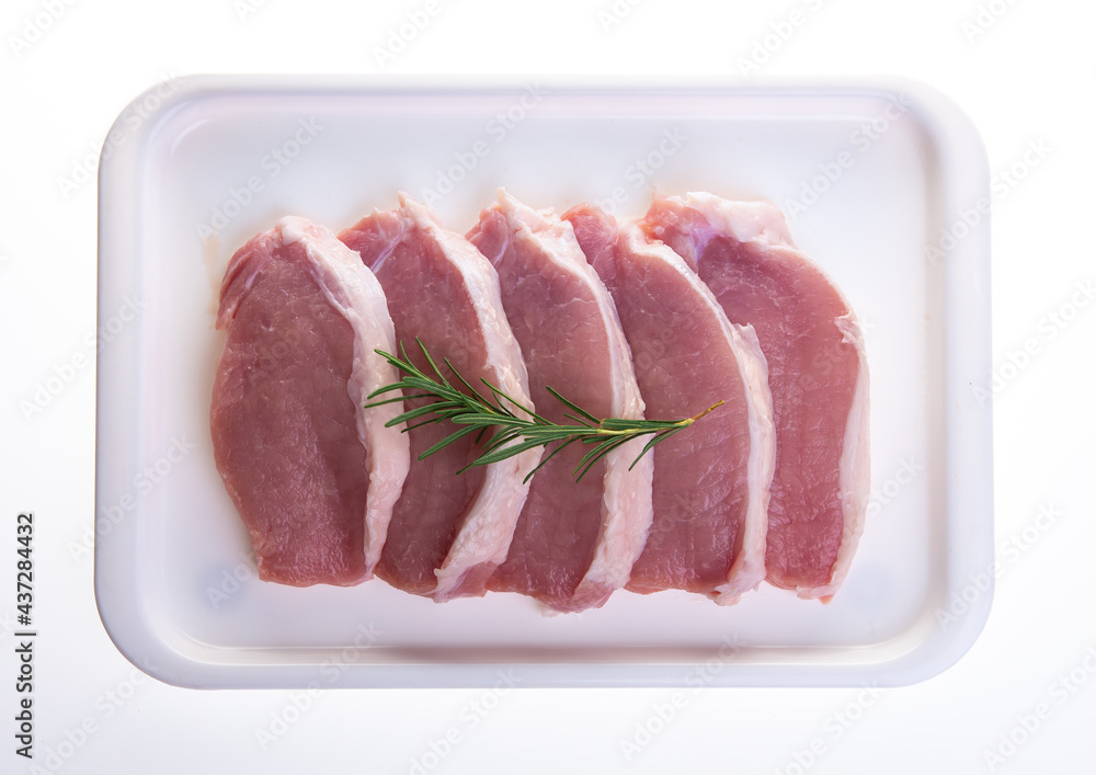 Raw pork meat in tray on white background Raw pork meat in tray on white background