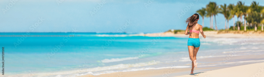 Athlete runner fitness woman running on Caribbean beach landscape banner panoramic background. Active exercise fit girl training cardio in summer lifestyle. Athlete runner fitness woman running on Caribbean beach landscape banner panoramic background. Active exercise fit girl training cardio in summer lifestyle.