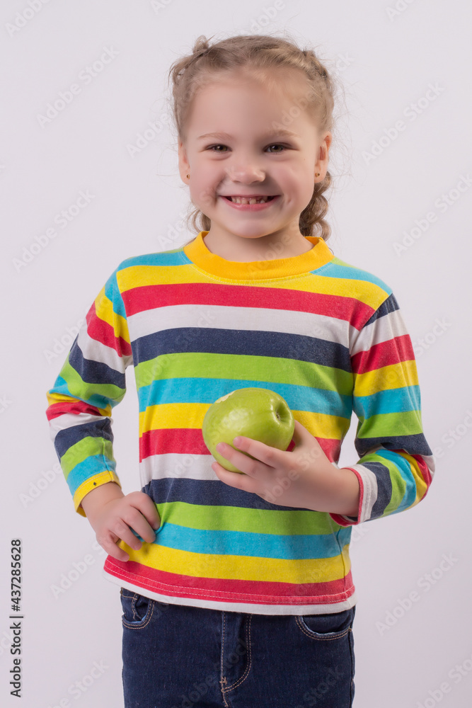 a happy little blonde girl with pigtails in a colored jacket holds an apple in her hands that she ate
a happy little blonde girl with pigtails in a colored jacket holds an apple in her hands that she ate