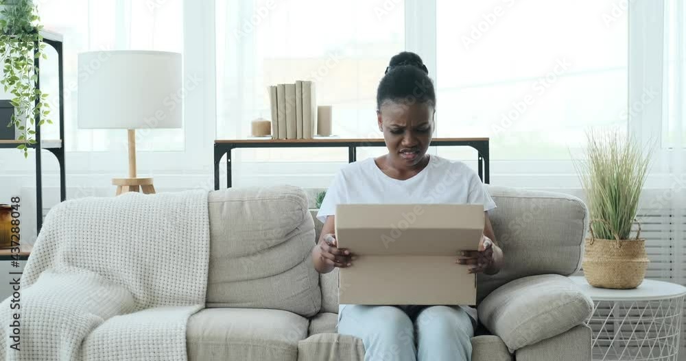 Woman upset on unboxing wrong delivery of shoes at home Woman upset on unboxing wrong delivery of shoes at home
