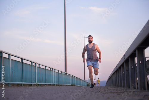 Fototapeta Naklejka Na Ścianę i Meble -  Running outside during an early morning