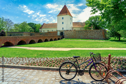 famous Nadasy castle fortress in Sarvar Hungary on a nice summer day with a bicycle on a tour photo