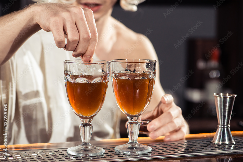 Cocktail bars, bartender making a cocktail February 6th Bartender's Day, toned