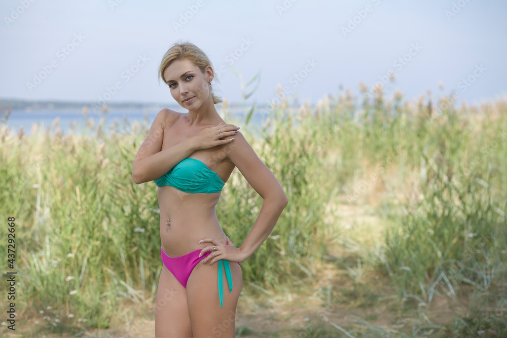 Beautiful young woman at the beach