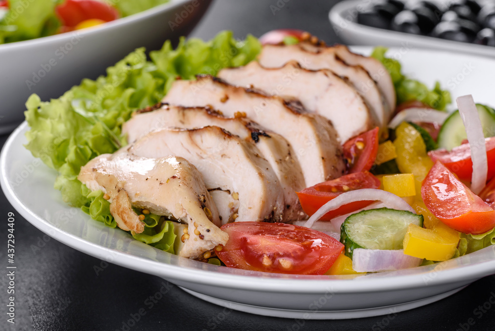 Fresh delicious salad with chicken, tomato, cucumber, onions and greens with olive oil Fresh delicious salad with chicken, tomato, cucumber, onions and greens with olive oil