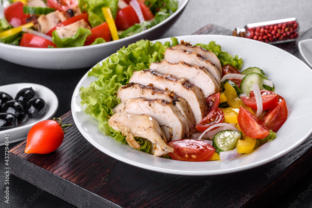 Fresh delicious salad with chicken, tomato, cucumber, onions and greens with olive oil Fresh delicious salad with chicken, tomato, cucumber, onions and greens with olive oil