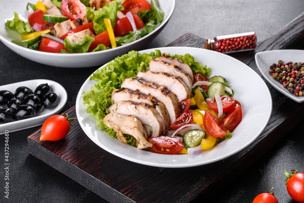 Fresh delicious salad with chicken, tomato, cucumber, onions and greens with olive oil Fresh delicious salad with chicken, tomato, cucumber, onions and greens with olive oil