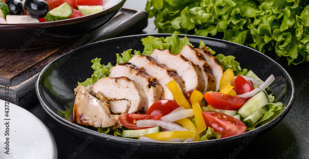 Fresh delicious salad with chicken, tomato, cucumber, onions and greens with olive oil Fresh delicious salad with chicken, tomato, cucumber, onions and greens with olive oil